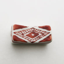 Load image into Gallery viewer, Chopstick rest with pebbled pattern (red)