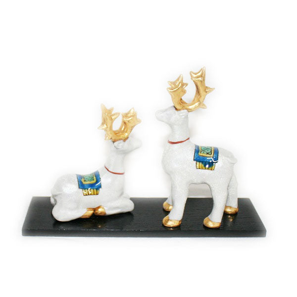 Kutani Yaki ware of a pair of hand-painted Christmas reindeer (with a decorative stand)